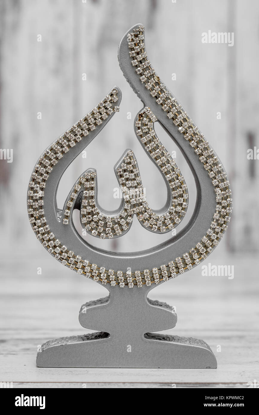 Silver and Golden Religious Statuette with the Name of Allah Stock ...