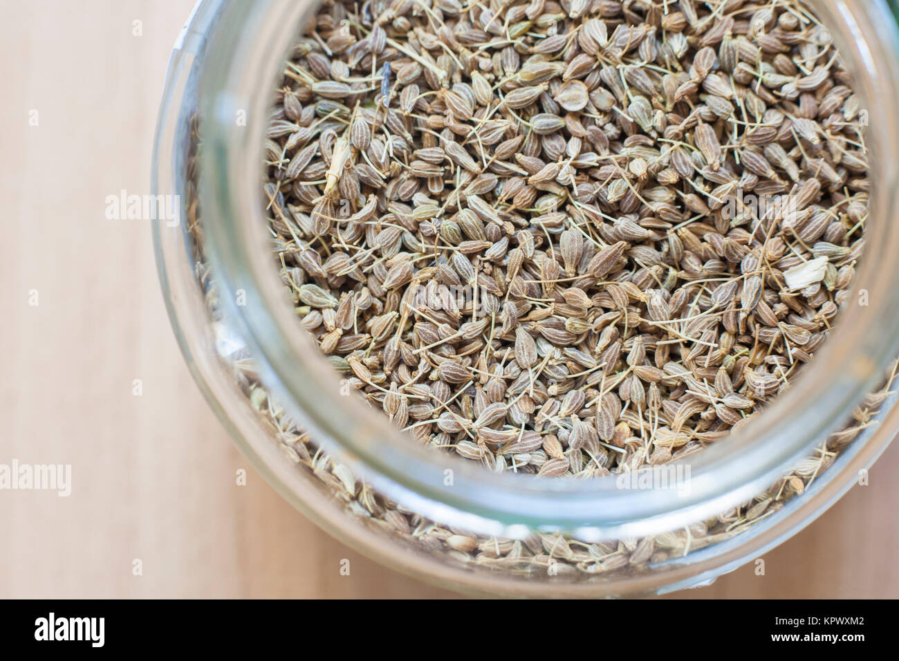 Glass jar with aniseed grains Stock Photo
