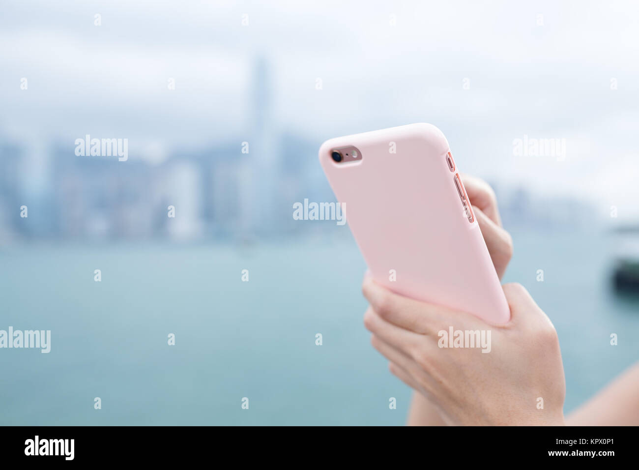 Woman use of smart phone in Hong Kong city Stock Photo - Alamy