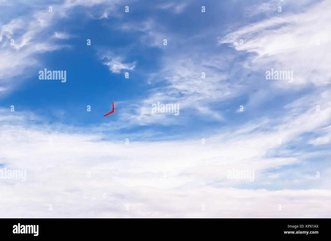 Red boomerang in flight Stock Photo
