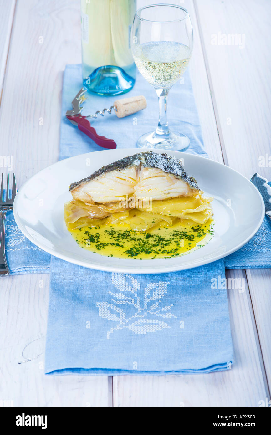 Oven baked cod fish with potatoes Stock Photo - Alamy