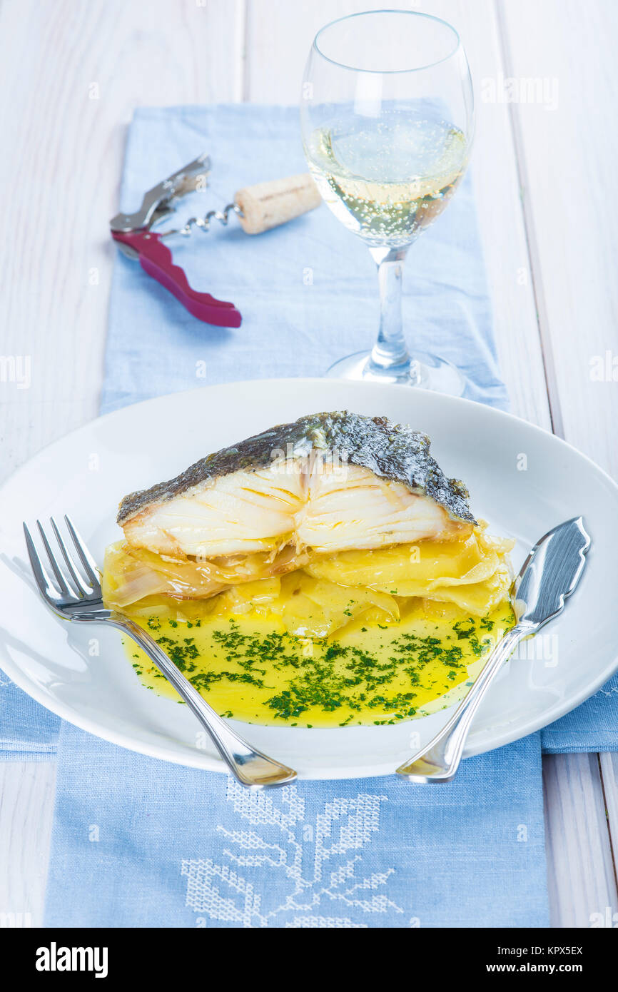 Oven baked cod fish with potatoes Stock Photo - Alamy