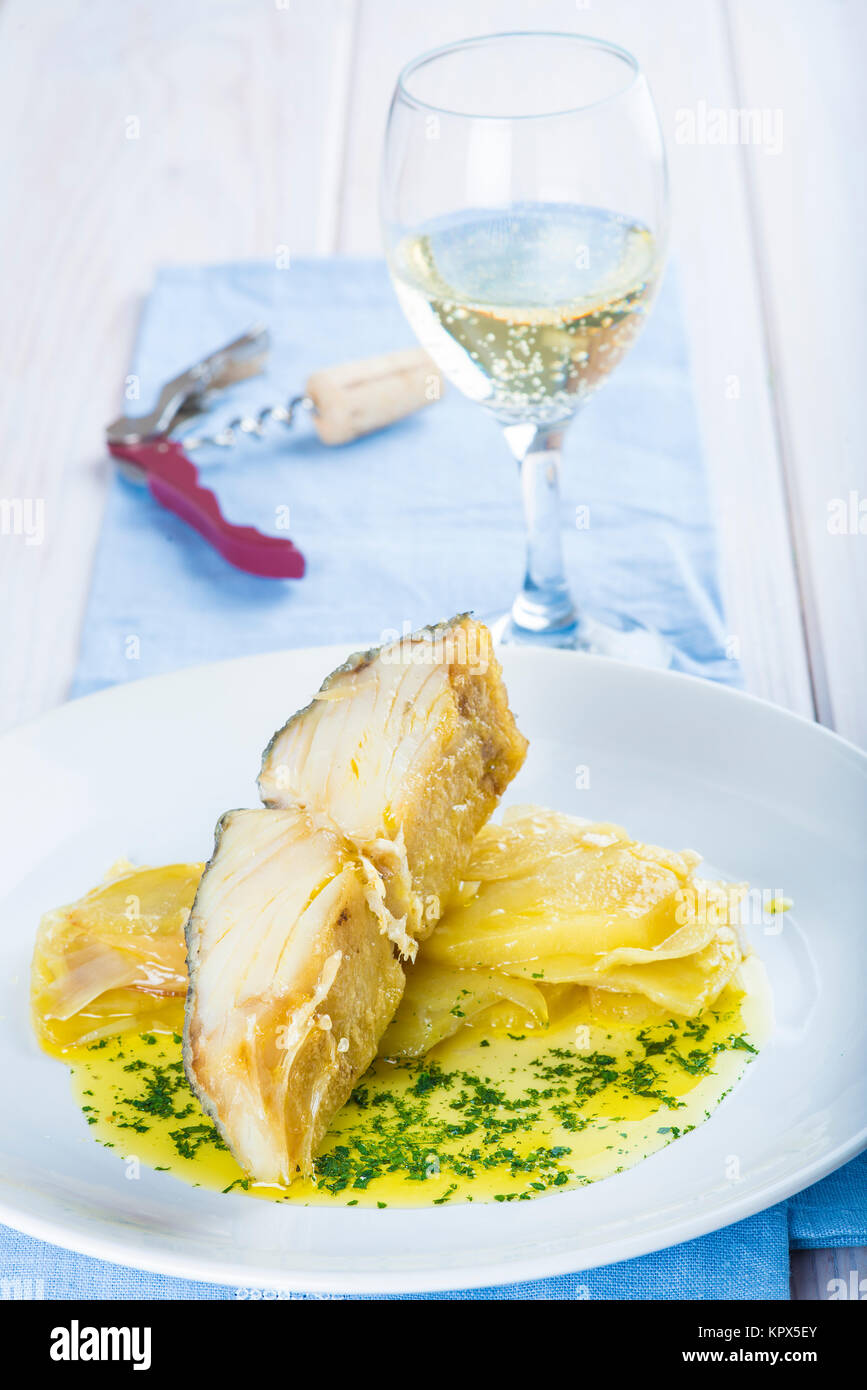 Oven baked cod fish with potatoes Stock Photo - Alamy