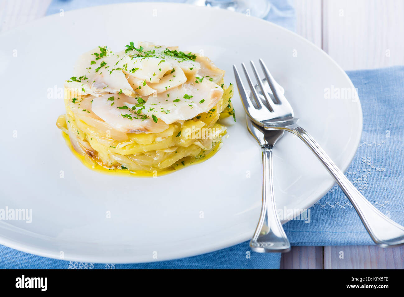 Oven baked cod fish with potatoes Stock Photo - Alamy