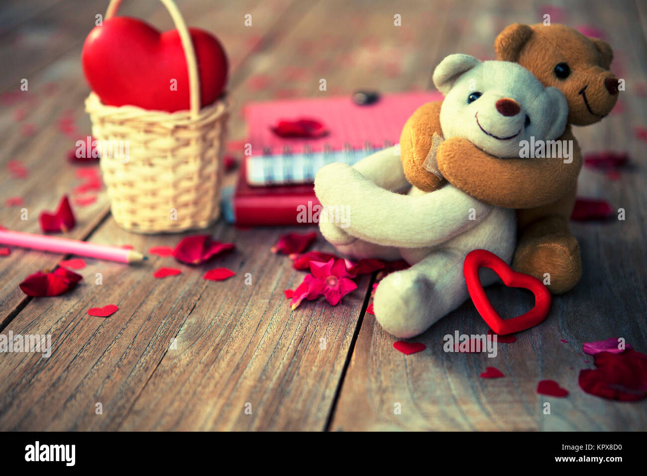 lovely teddy bears on wooden floor for valentines day, grunge filtered photo Stock Photo