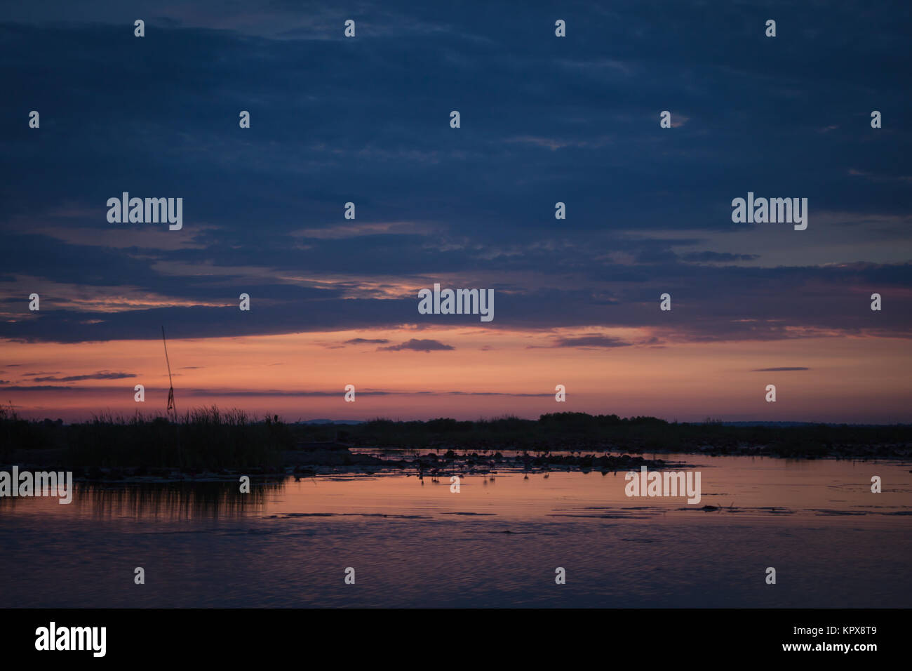 Sunrise on the lake with beautiful sky Stock Photo - Alamy