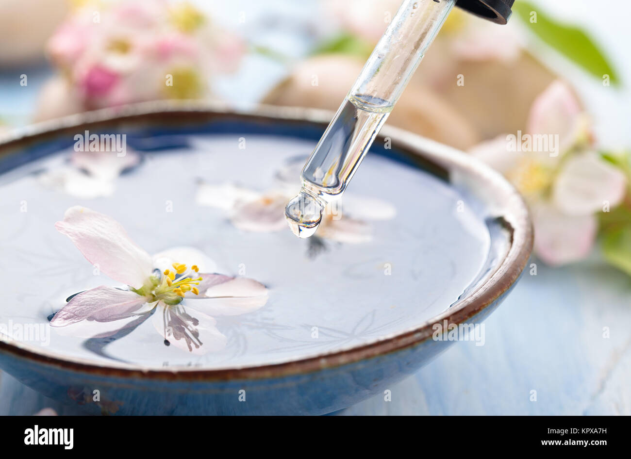 Scented water and flowers. Stock Photo