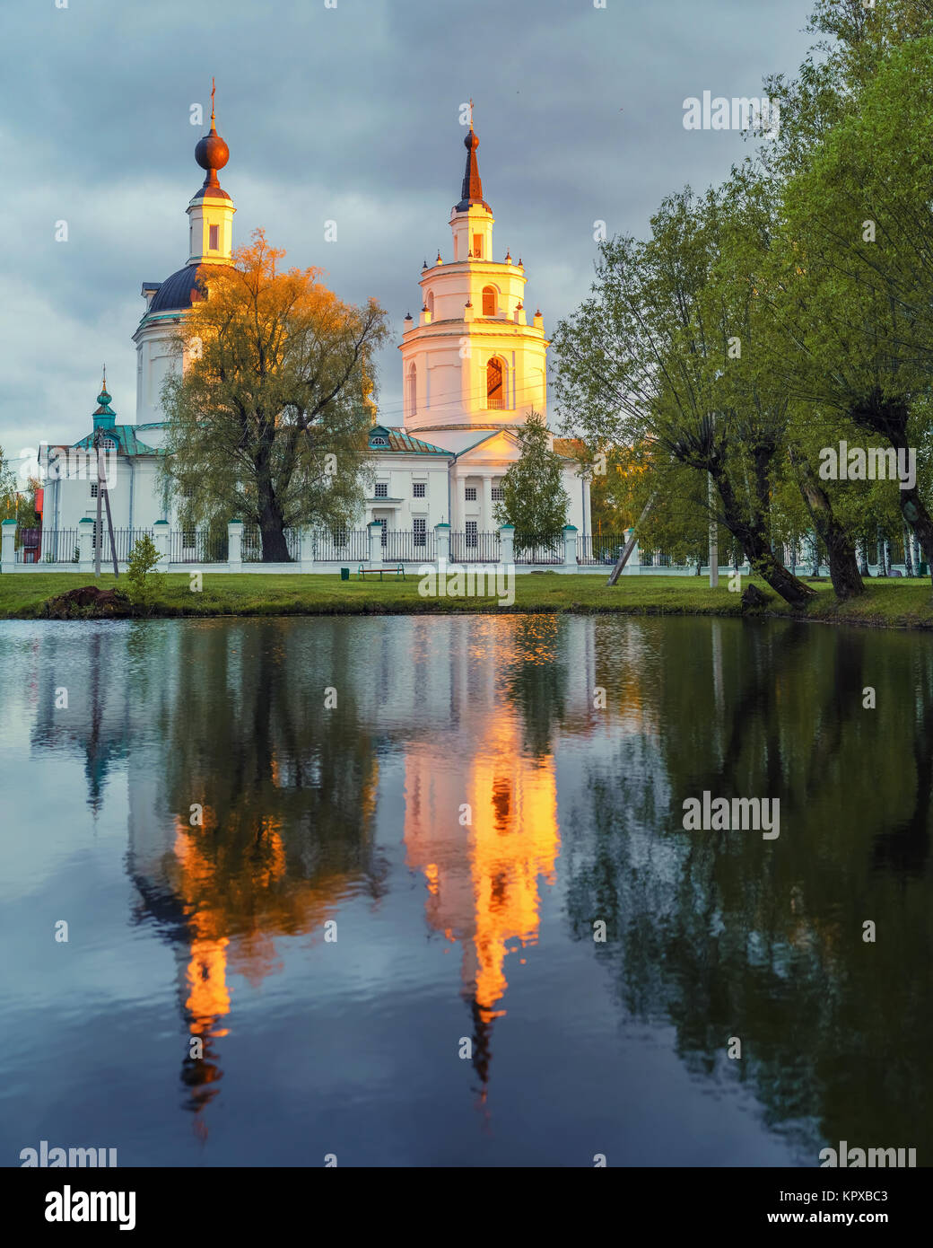 Ortodox church and its reflection in a pond. Stock Photo