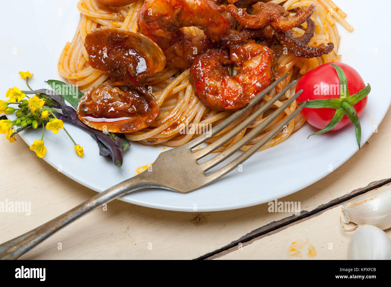 Italian seafood spaghetti pasta on red tomato sauce Stock Photo - Alamy
