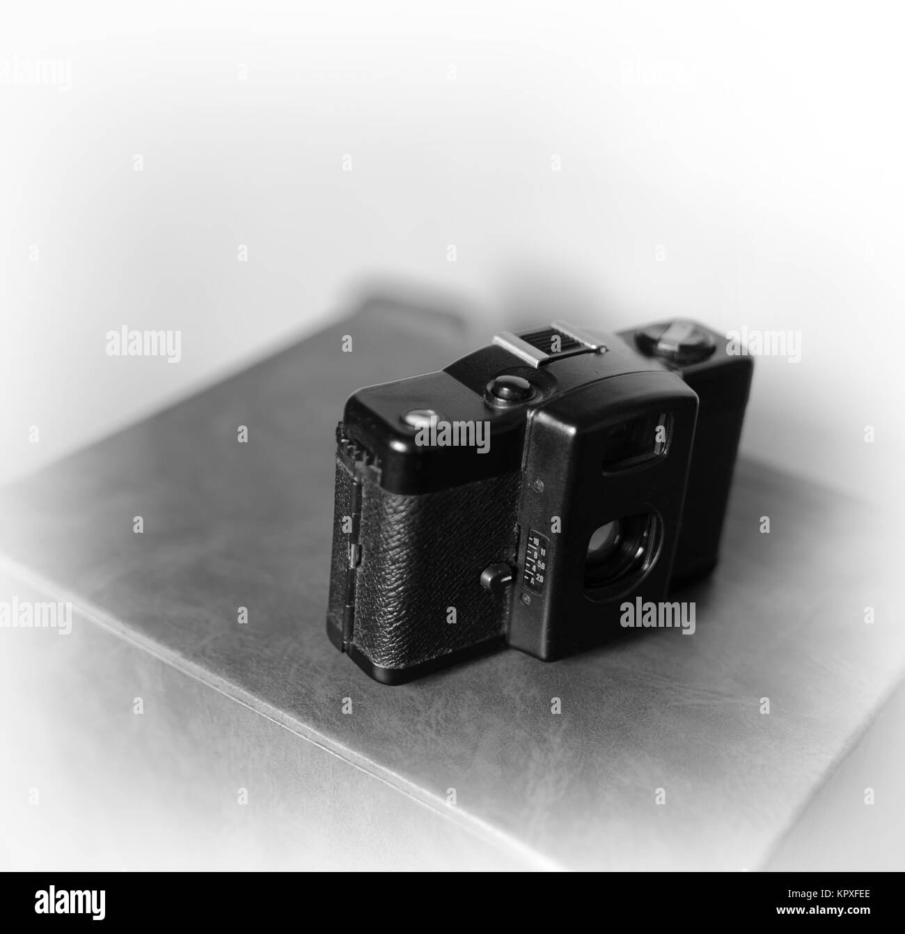 Black and white vintage camera bokeh background Stock Photo