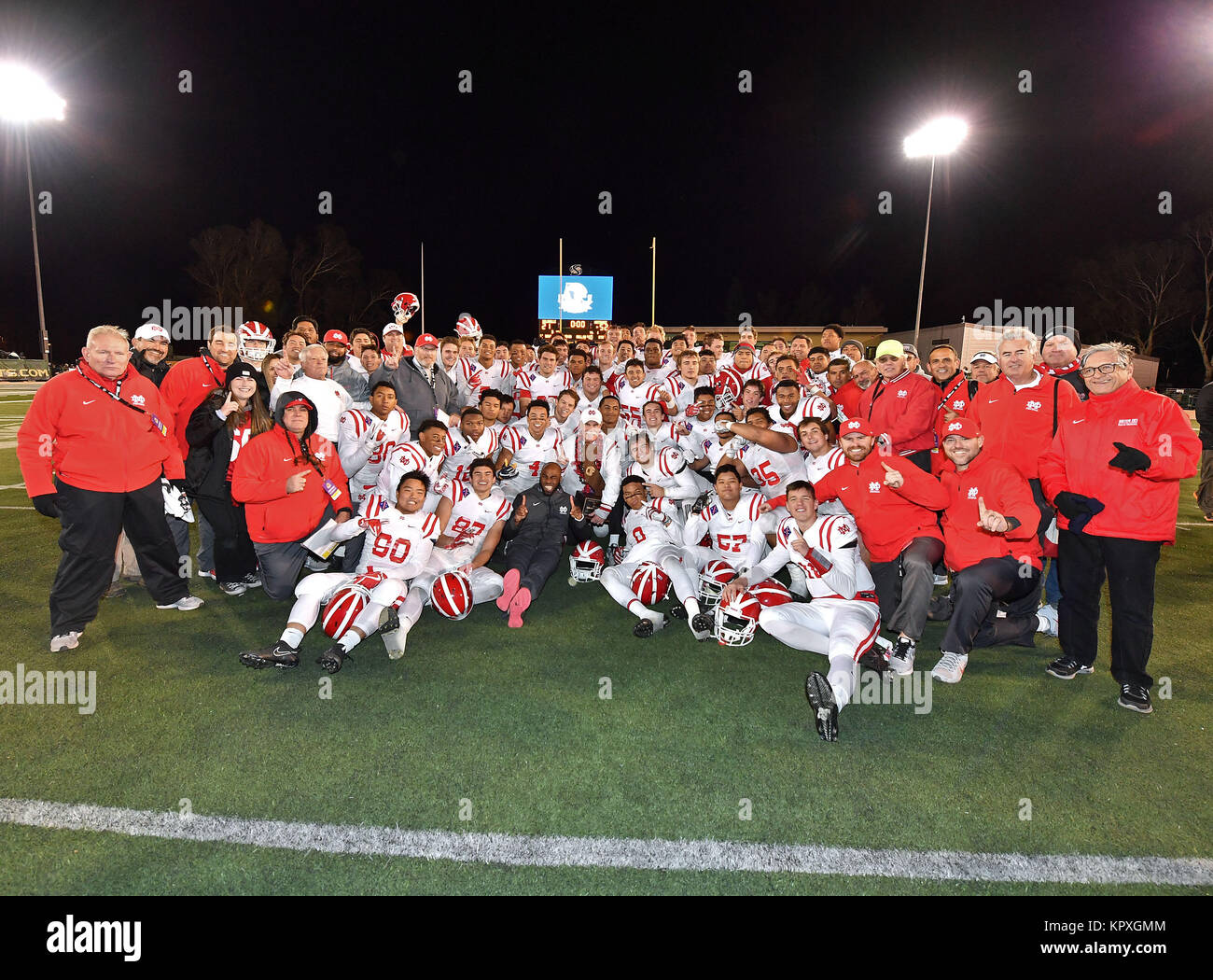 Sacramento, CA. 17th Dec, 2017. Mater Dei Monarchs head coach Bruce Rollinson and his players pose with the trophy after winning the CIF State Prep Football Open Division State Championship Game.Mater Dei vs. De La Salle of Concord.The Mater Dei Monarchs defeated the De La Salle Spartans 52-21.Louis Lopez/Cal Sport Media/Alamy Live News Stock Photo