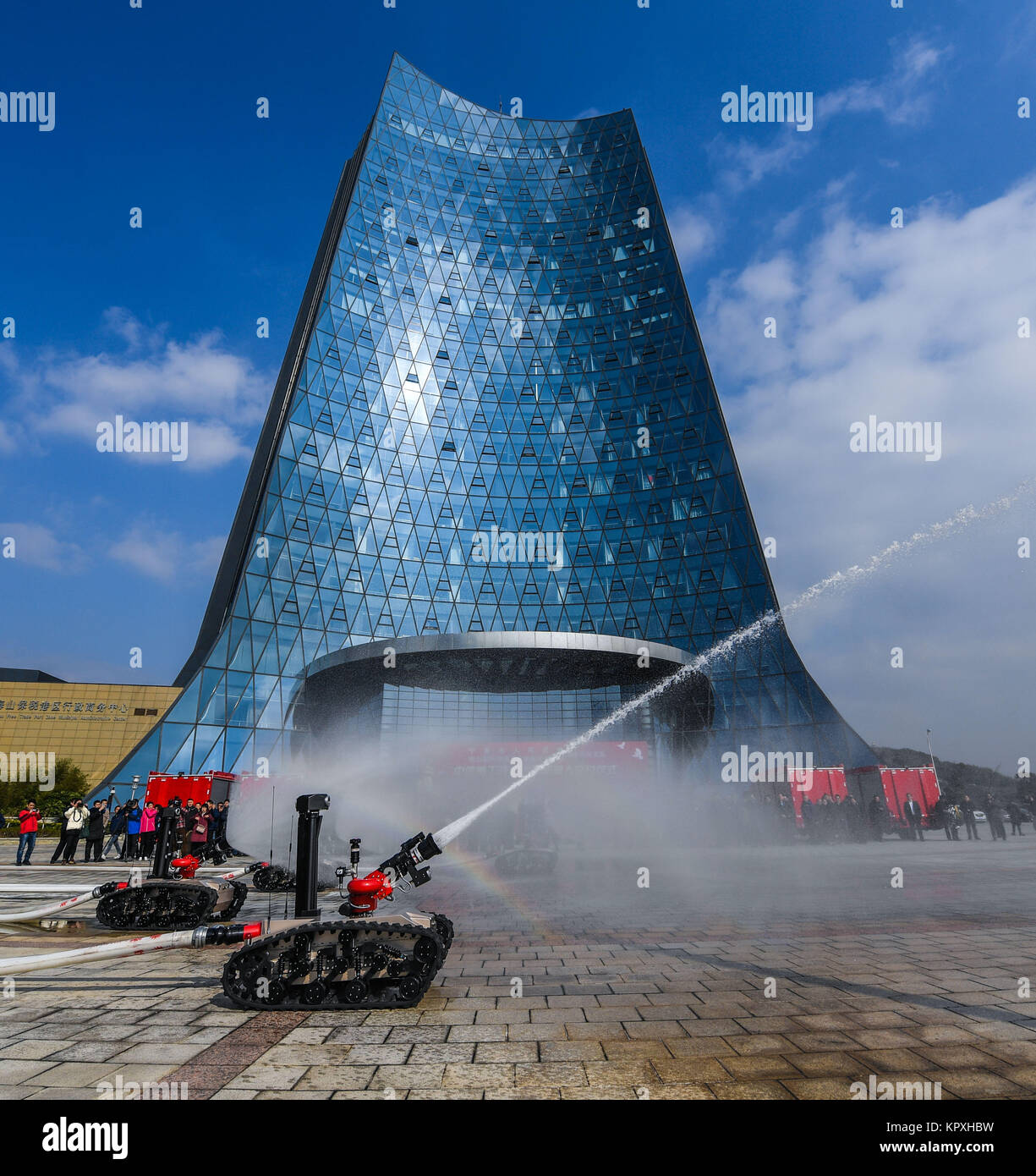 Ningbo. 17th Dec, 2017. Fire robots demonstrate during a drill at a delivery ceremony in Meishan Free Trade Port Area of Ningbo, east China's Zhejiang Province. A total of 60 anti-explosion fire robots were delivered here Sunday. Credit: Xu Yu/Xinhua/Alamy Live News Stock Photo