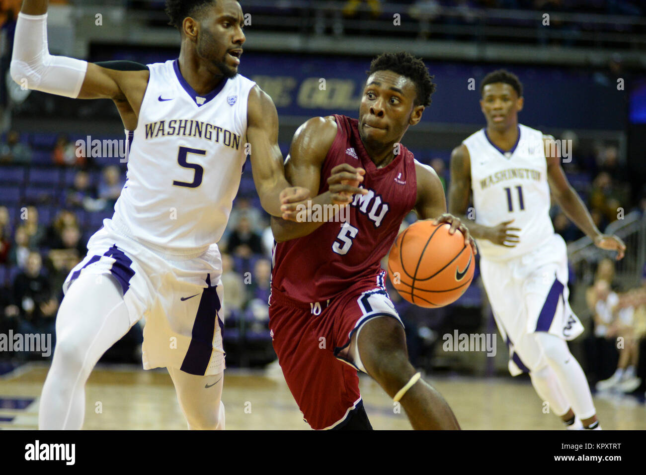 Seattle, WA, USA. 17th Dec, 2017. LMU guard James Batemon (5) drives the lane against UW defender Jaylen Nowell (5) during an NCAA basketball game between the Washington Huskies and LMU Lions. The game was played at Hec Ed Pavilion in Seattle, WA. Jeff Halstead/CSM/Alamy Live News Stock Photo