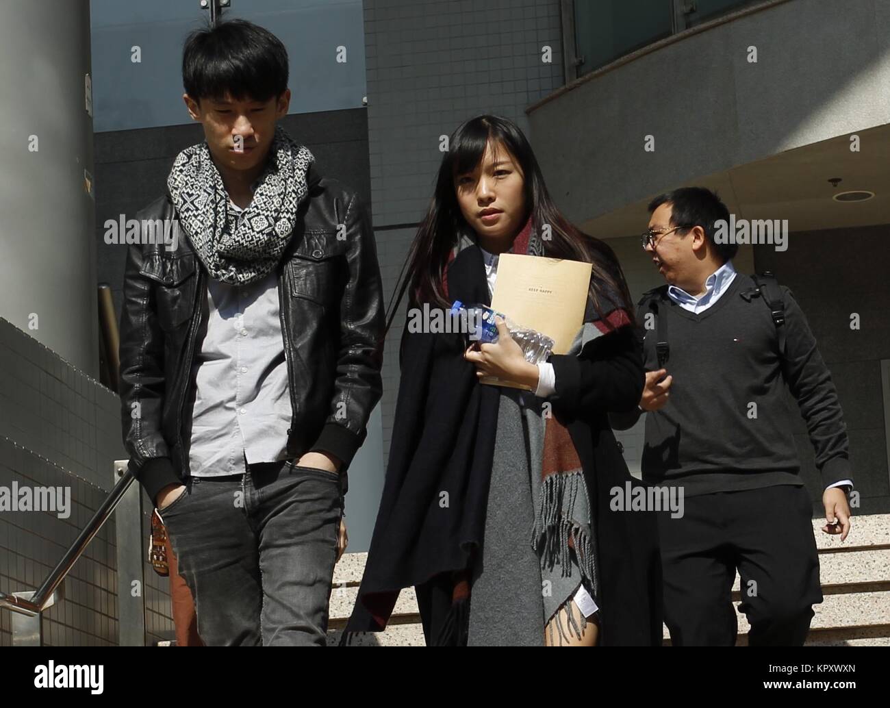 Hong Kong, CHINA. 18th Dec, 2017. Disqualified Localist lawmakers of the pro-Hong Kong Independence political party YOUNGSPIRATION, Baggio Leung ( L ) and Yau Wai-ching ( R ) walk out of Kowloon City Magistracy. Both Leung and Yau are charged with unlawful assembly inside LEGICO building and forced entry into conference room. Case adjourned for tomorrow 19-December. 18-December 2017.Hong Kong.ZUMA/Liau Chung Ren Credit: Liau Chung Ren/ZUMA Wire/Alamy Live News Stock Photo