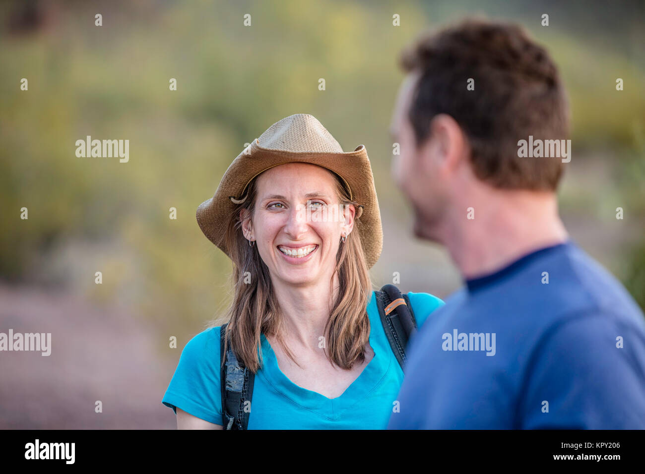 Smiling Woman on Nature Hike Stock Photo