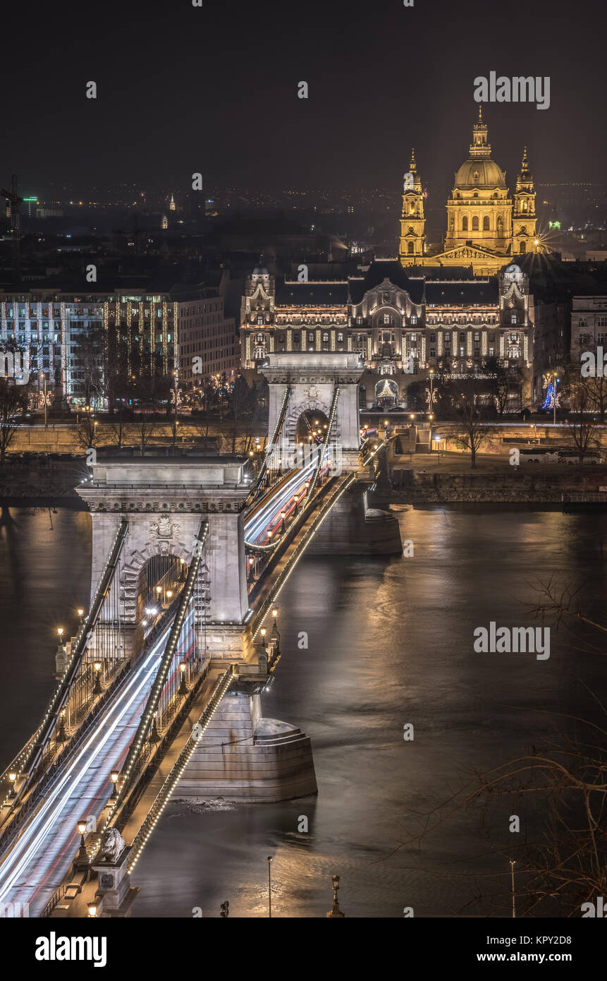 Chain Bridge and St. Stephen's Basilica in Budapest, Hungary at Night Stock Photo