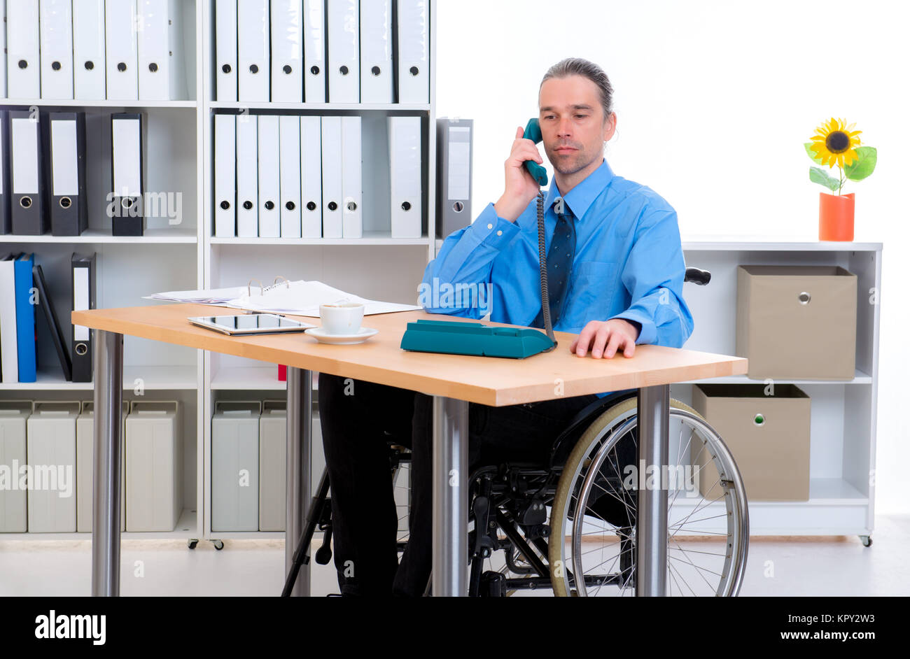 disabled business man in wheelchair is calling Stock Photo - Alamy