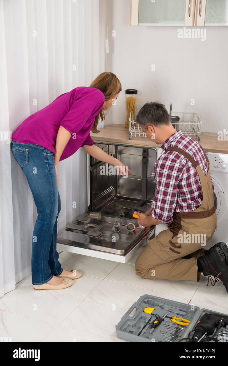 Repairman Checking Dishwasher With Digital Multimeter Stock Photo Alamy