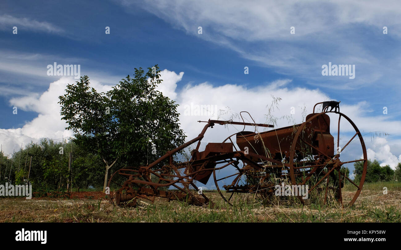 rusty plough on the field Stock
