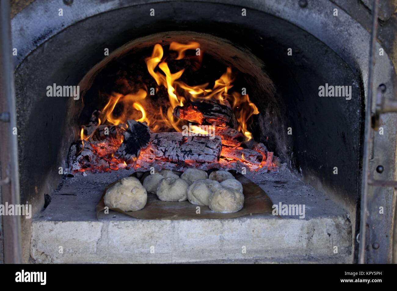bread in the oven with fire Stock Photo Alamy