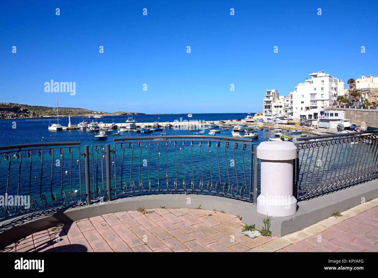 Wrought iron railings on a balcony along the promenade with views of