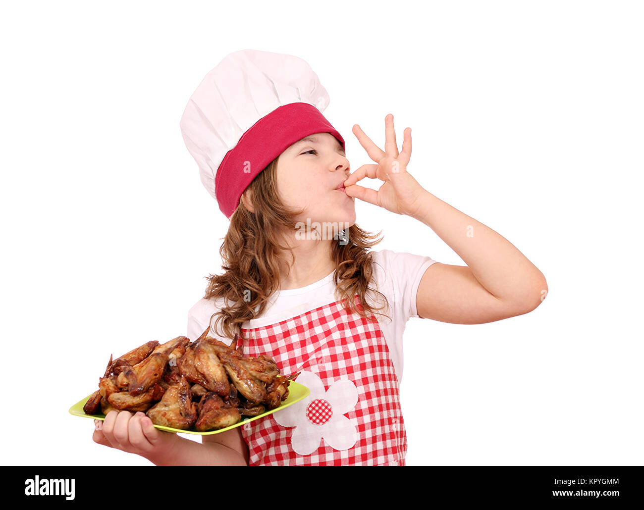 little girl cook with roasted chicken wings and ok hand sign Stock