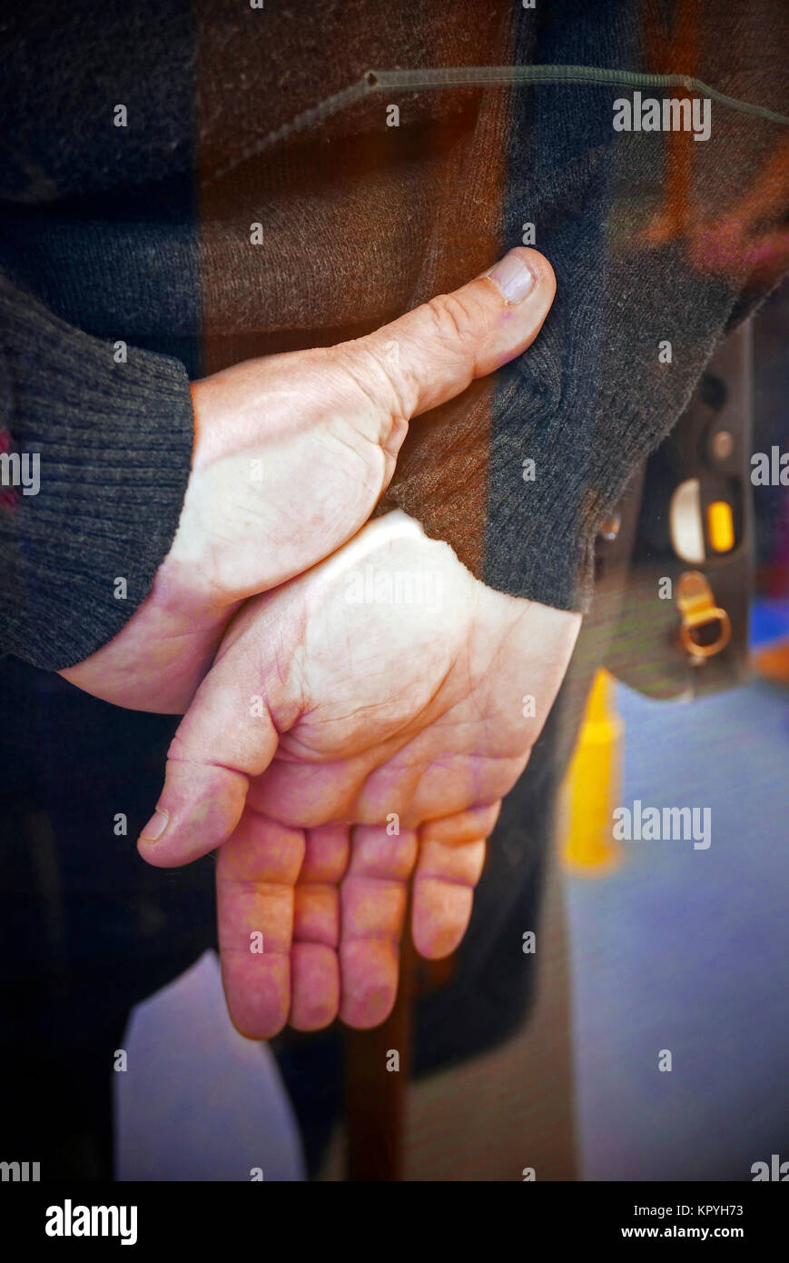Hands clasped behind back hires stock photography and images Alamy