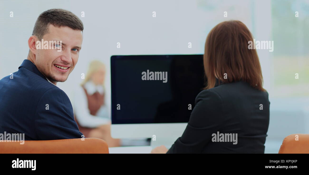 Business partners working on computer at modern office Stock Photo - Alamy