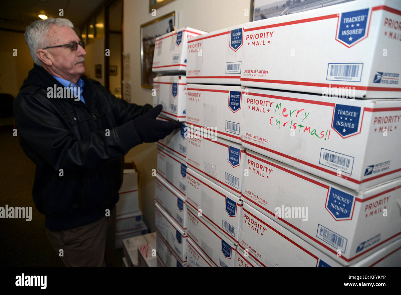Mr. Gary Schmidt 185th Air Refueling Wing Family Programs Manager takes donated care packages to the U.S. Post Office on December 14, 2017. The packages will be shipped to 185th ARW unit members who are deployed to a variety of locations around the world.   U.S. Air National Guard Stock Photo