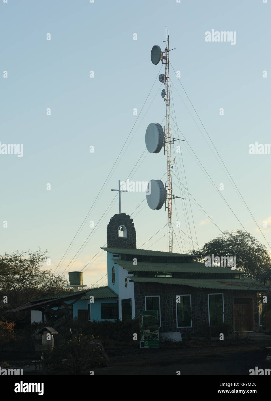 Church and communications mast at sunrise. Floreana, Galapagos, Ecuador. Stock Photo