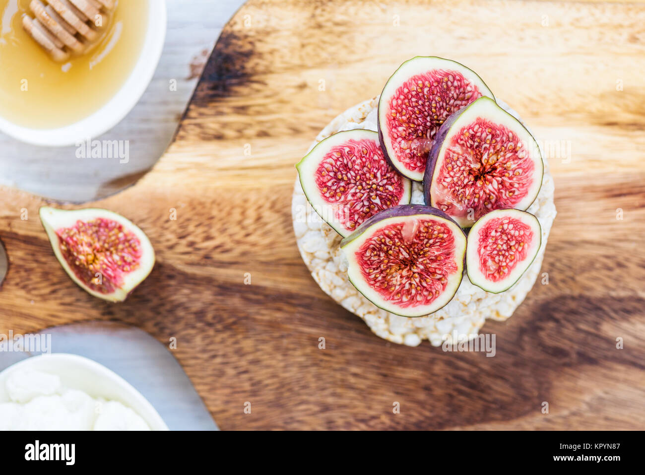Healthy snack from Rice cake or crackers, figs and ricotta cheese on