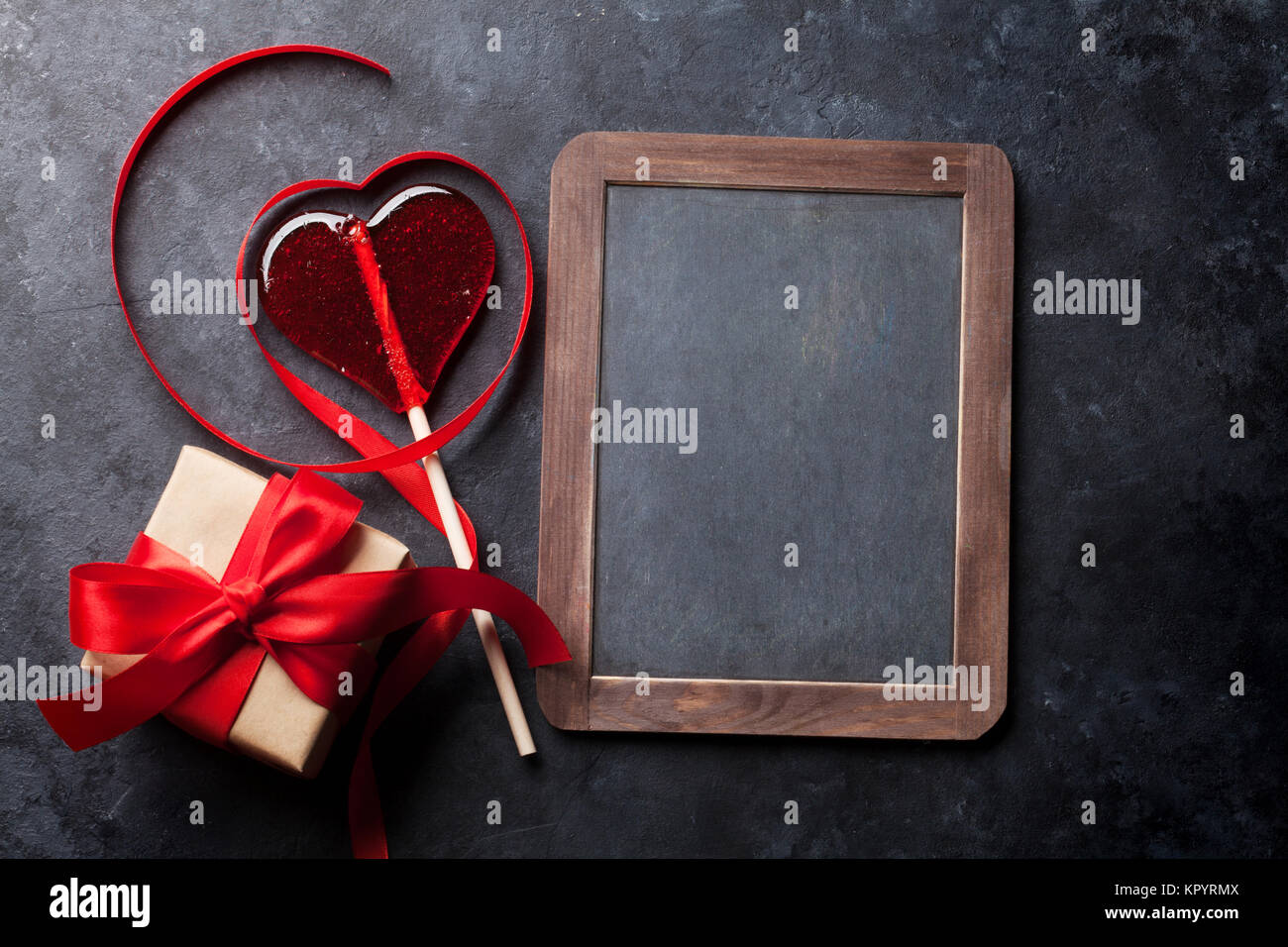 Valentines day greeting card. Heart shaped red ribbon, candy heart and ...