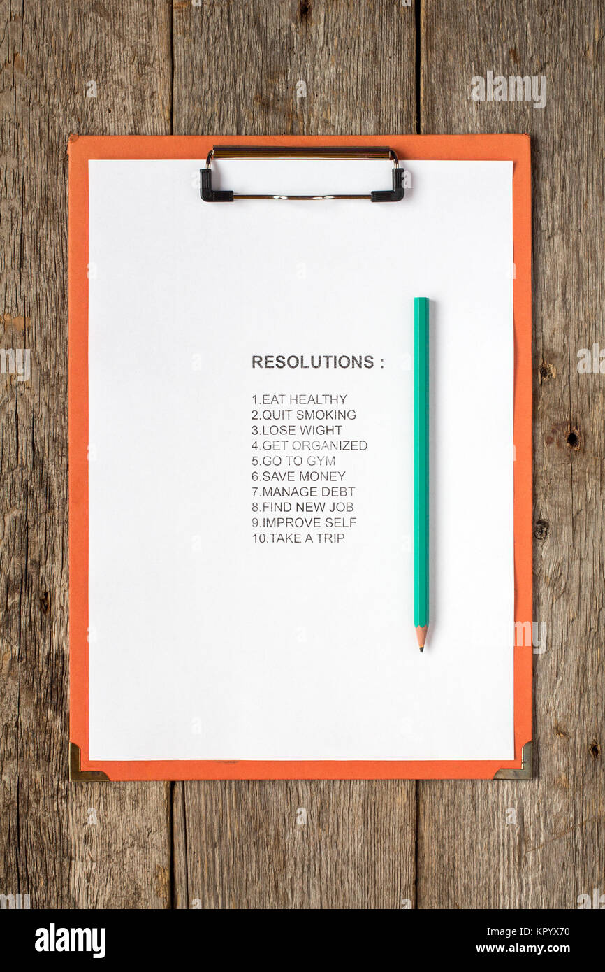 Clipboard with pencil and resolutions Stock Photo