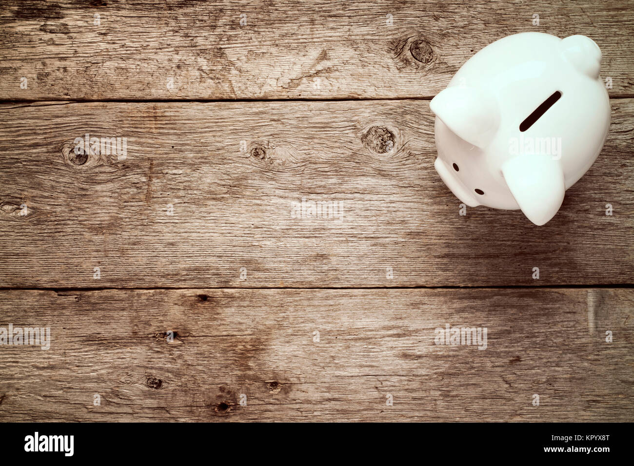 Piggy bank on the old wooden background Stock Photo - Alamy
