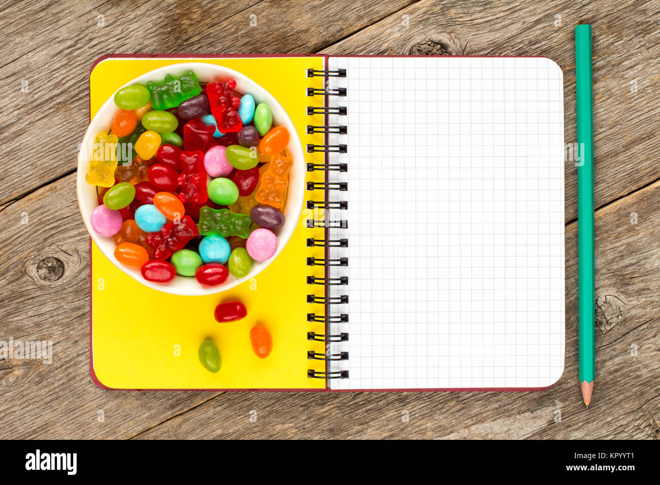 Blank notebook and candies Stock Photo
