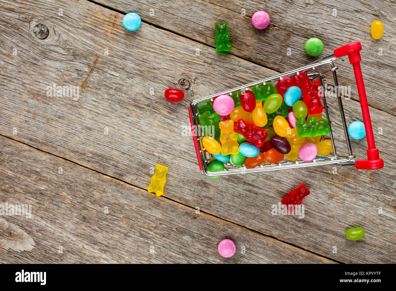 Shopping cart full of candies Stock Photo