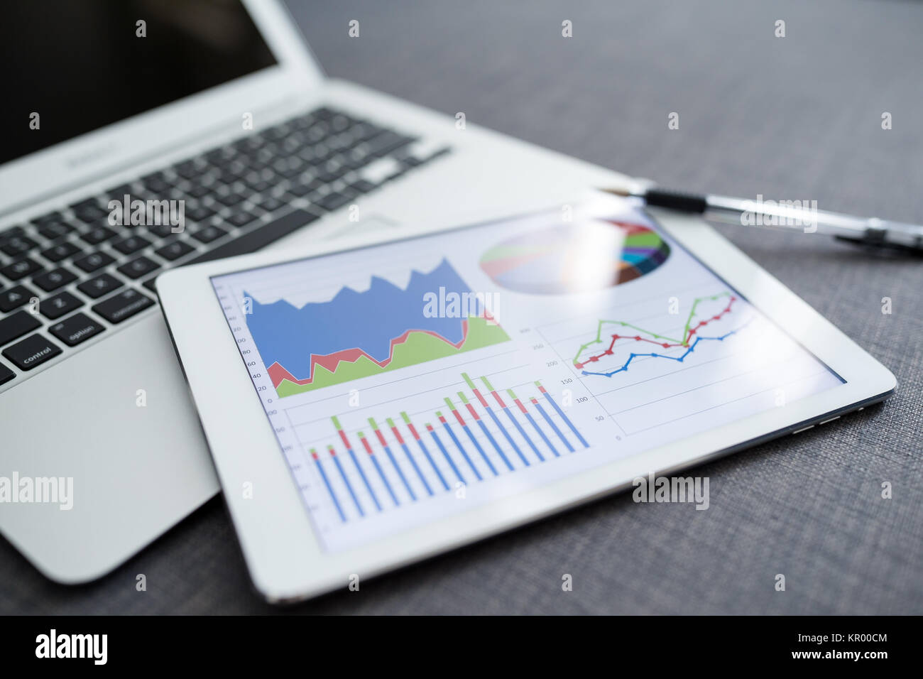 Digital computer with financial graph Stock Photo - Alamy