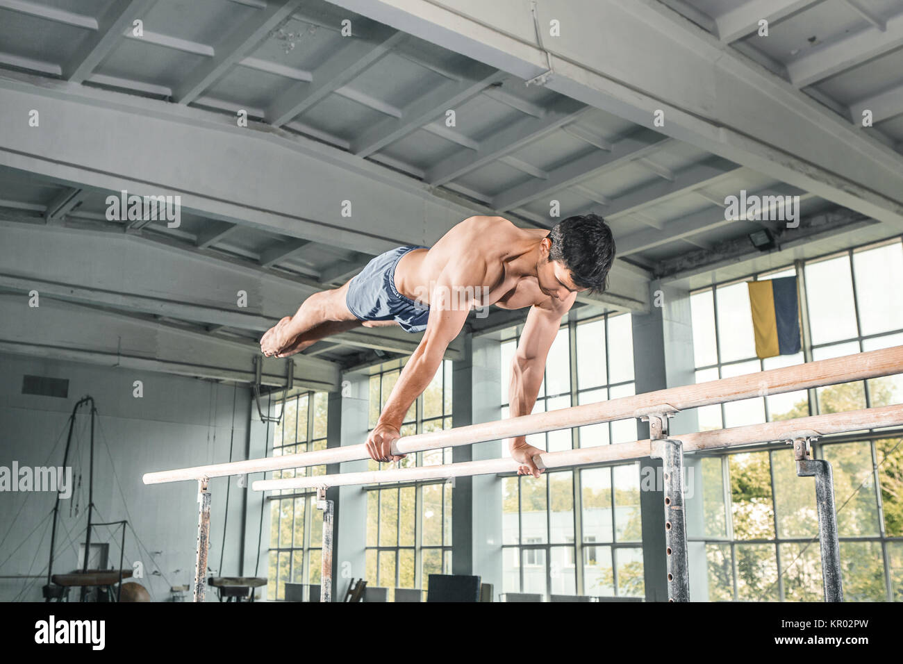 Male gymnast performing handstand on parallel bars Stock Photo Alamy