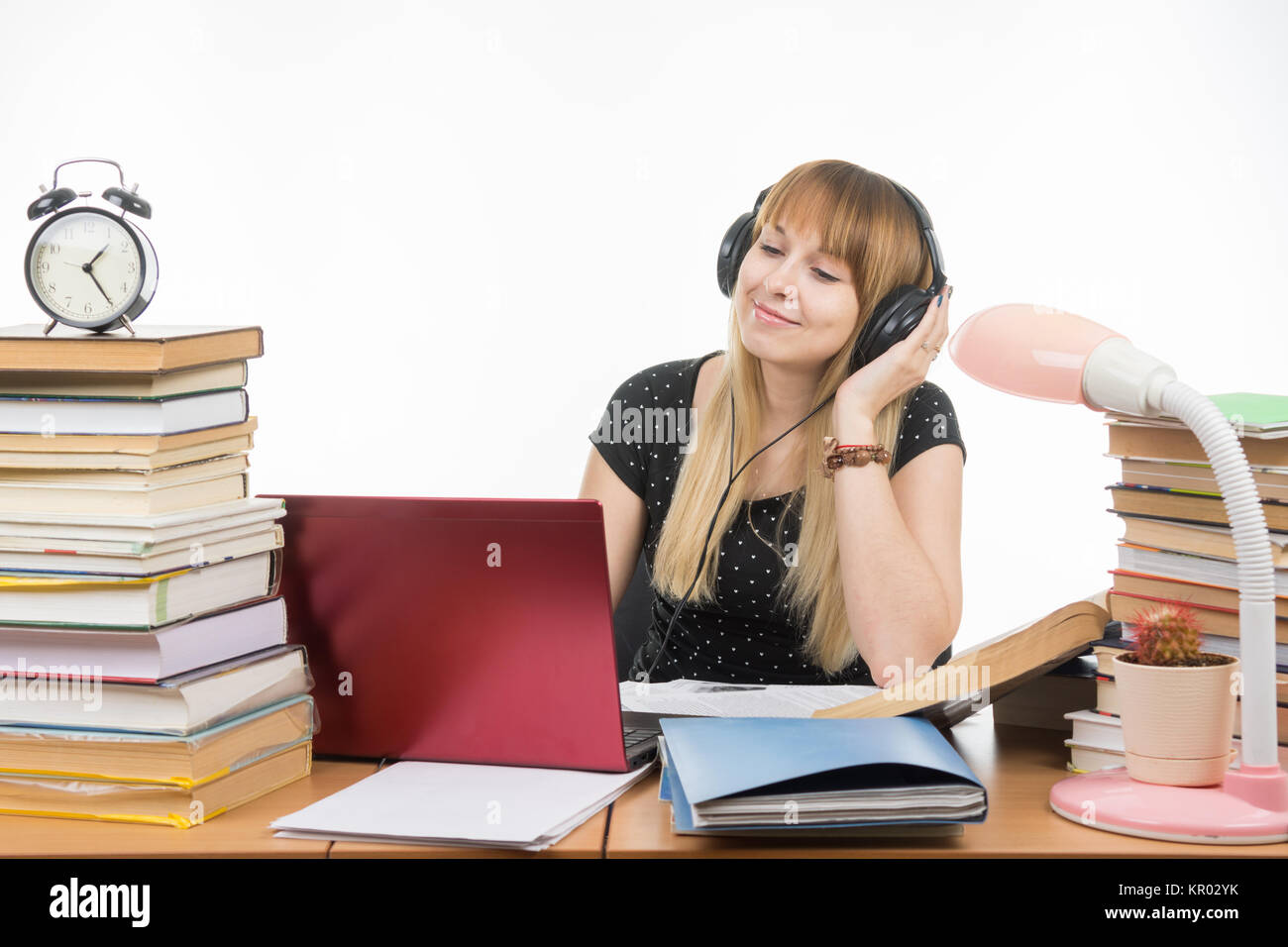 After hearing the student an interesting music on headphones Stock Photo