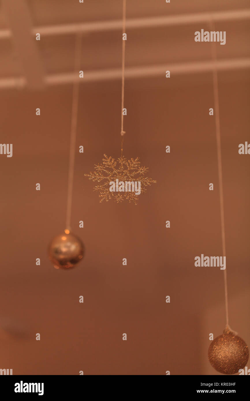Gold Silver Christmas Ornament Hanging From The Ceiling In