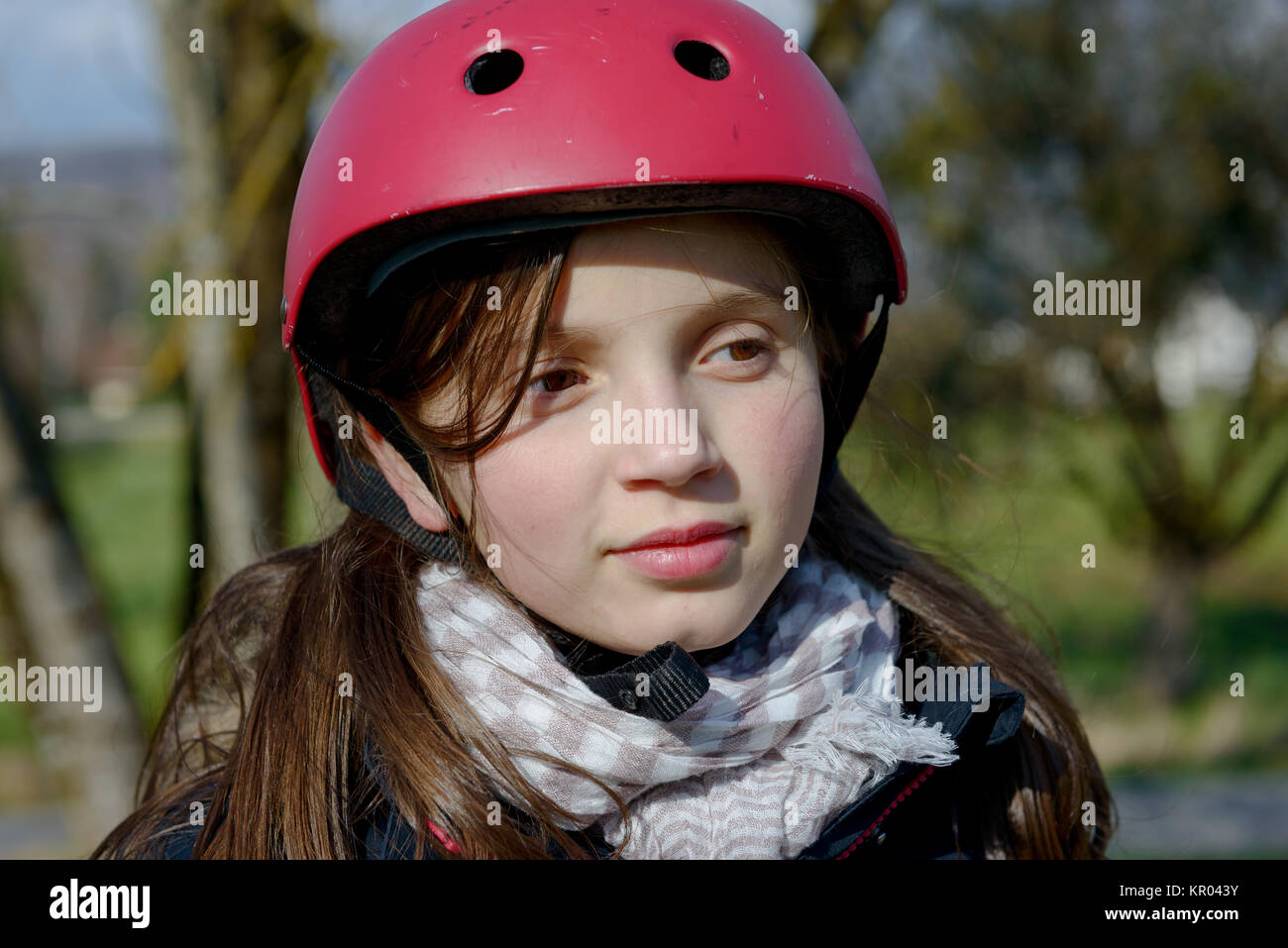 Teenage girl wearing a roller skate helmet Stock Photo Alamy