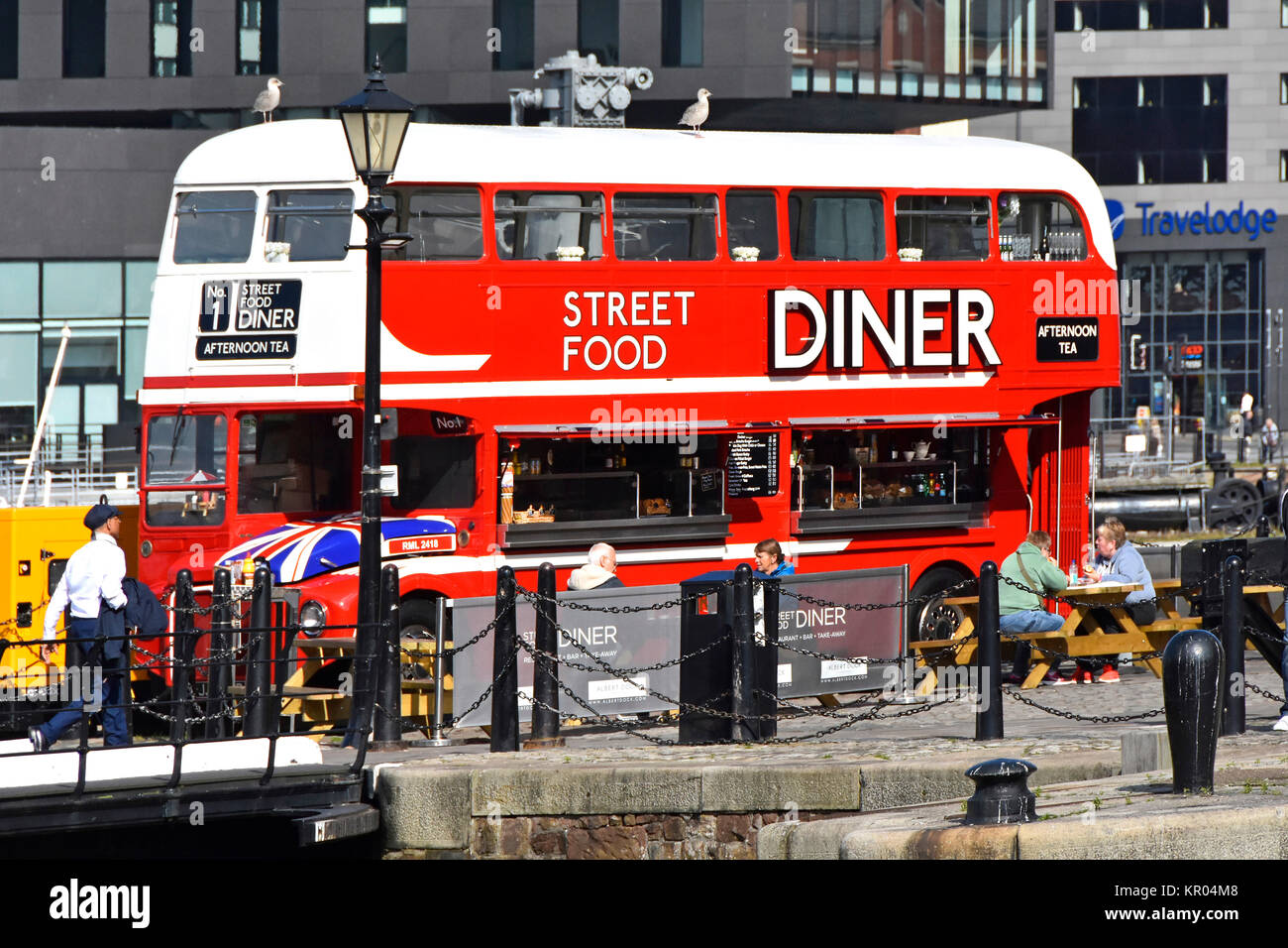 Routemaster bus converted into cafe diner come street food restaurant facility outdoor tables