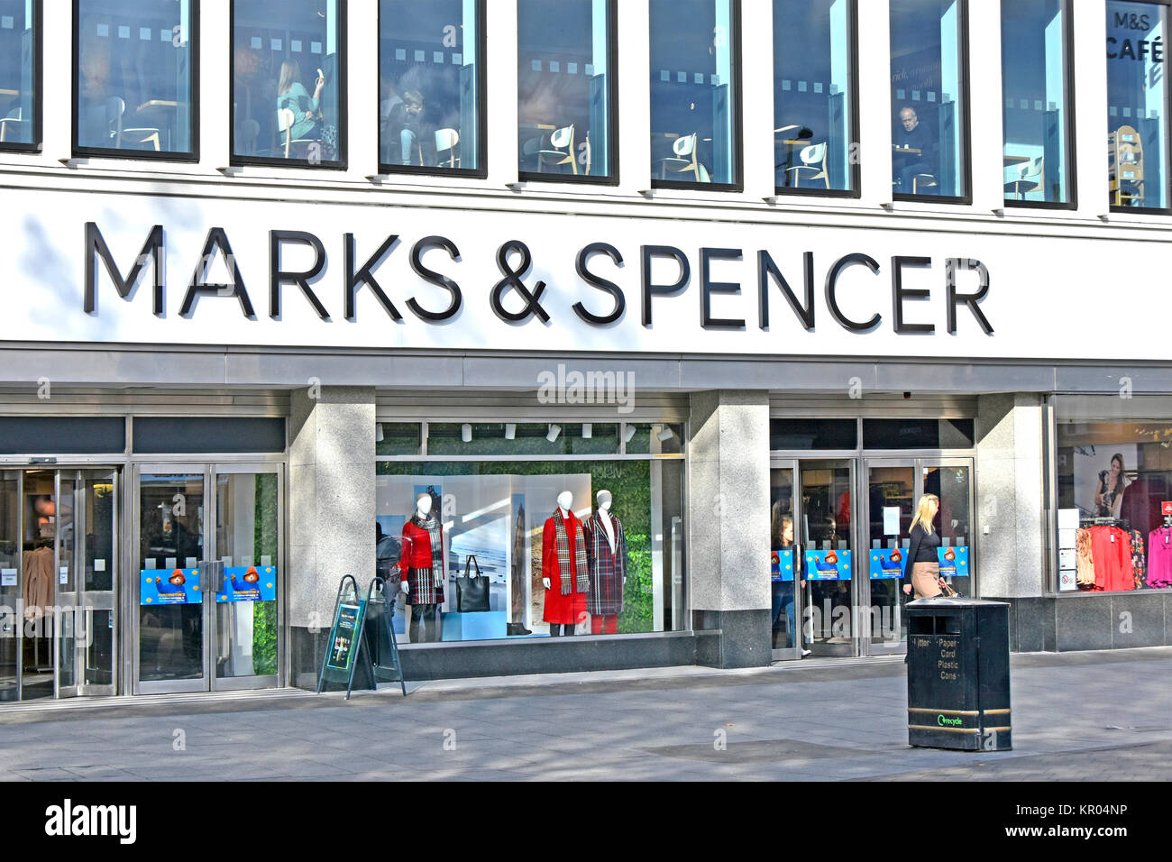 M&S high street store refurbished facade & interior new upper sales floor &  view of cafe customers at first floor window Brentwood Essex England UK Stock Photo