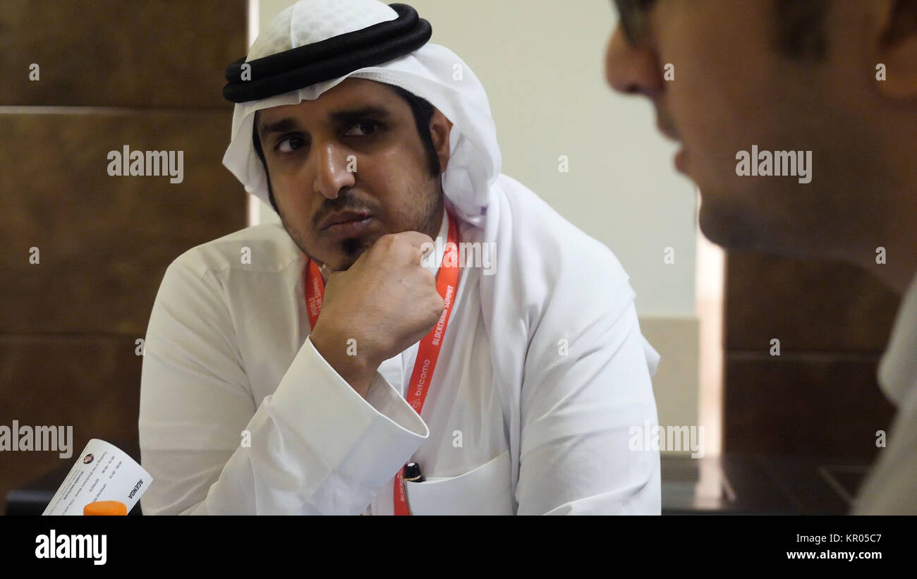 DUBAI UAE MAY 12 2017 Dubai World Trade Centre group of multi ethnic business people dealing a contract and hand shaking. Successful Arabic business people shaking hands over a deal Stock Photo Alamy