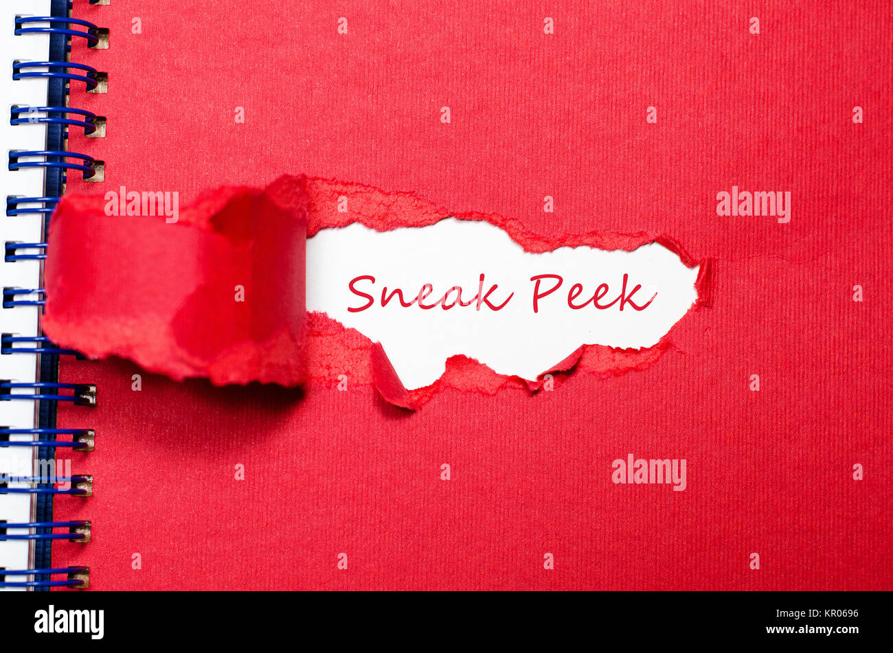 The word sneak peek appearing behind torn paper. Stock Photo