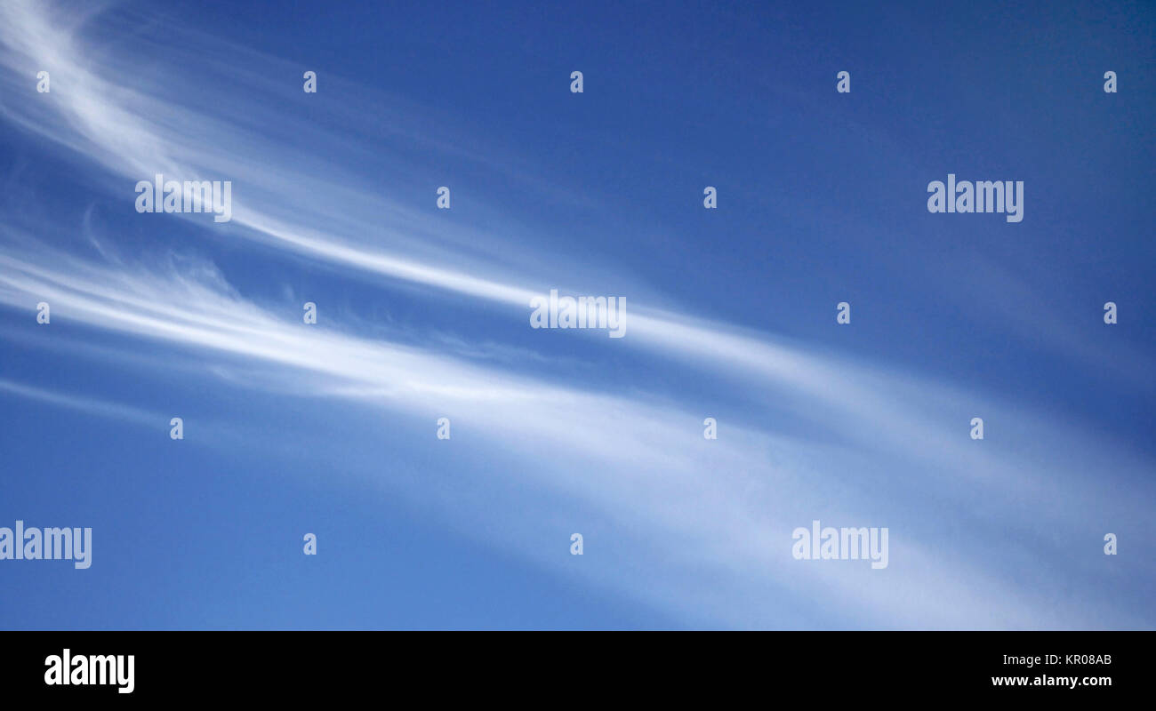 White wispy Cirrus clouds in a blue summer sky Stock Photo