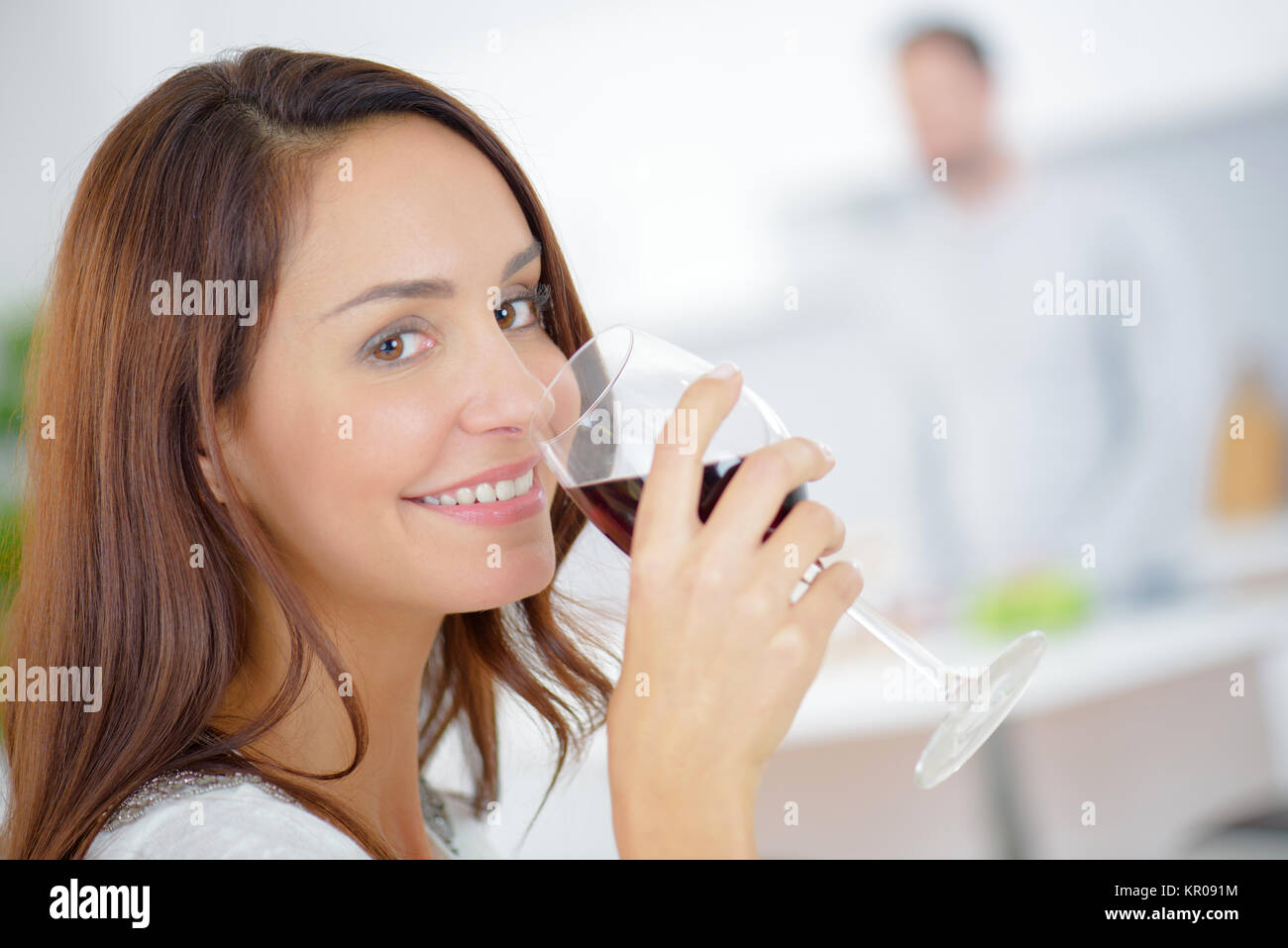 Having a glass of wine at home Stock Photo - Alamy