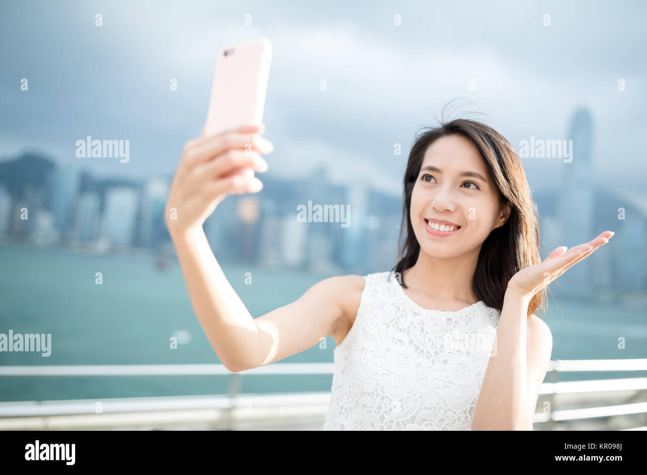 Woman taking self image in Hong Kong Stock Photo - Alamy