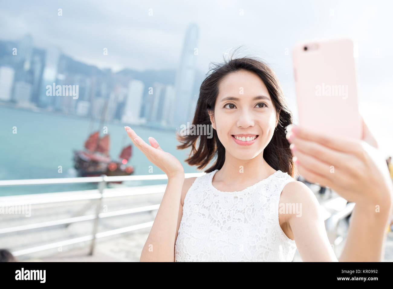 Woman taking selfie in Hong Kong Stock Photo - Alamy