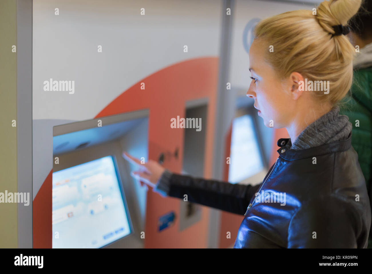Woman buying metro ticket at vending machine Stock Photo - Alamy